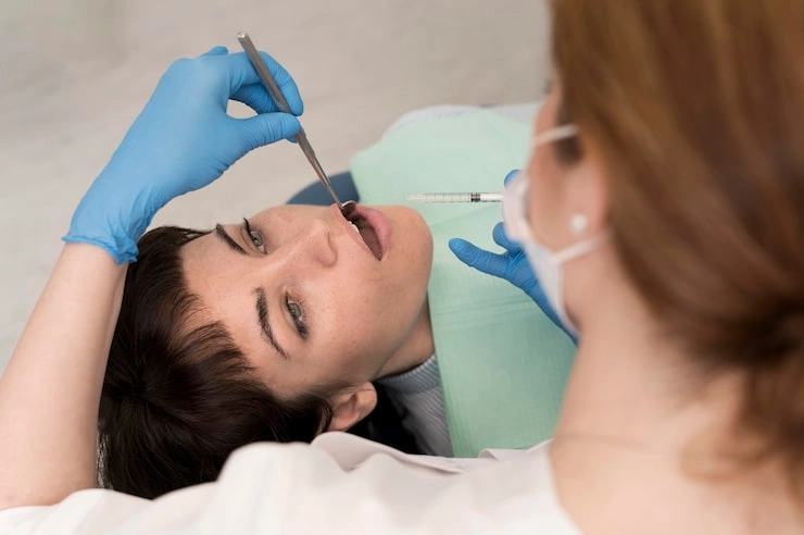 female patient having procedure done dentist 23 2148985795